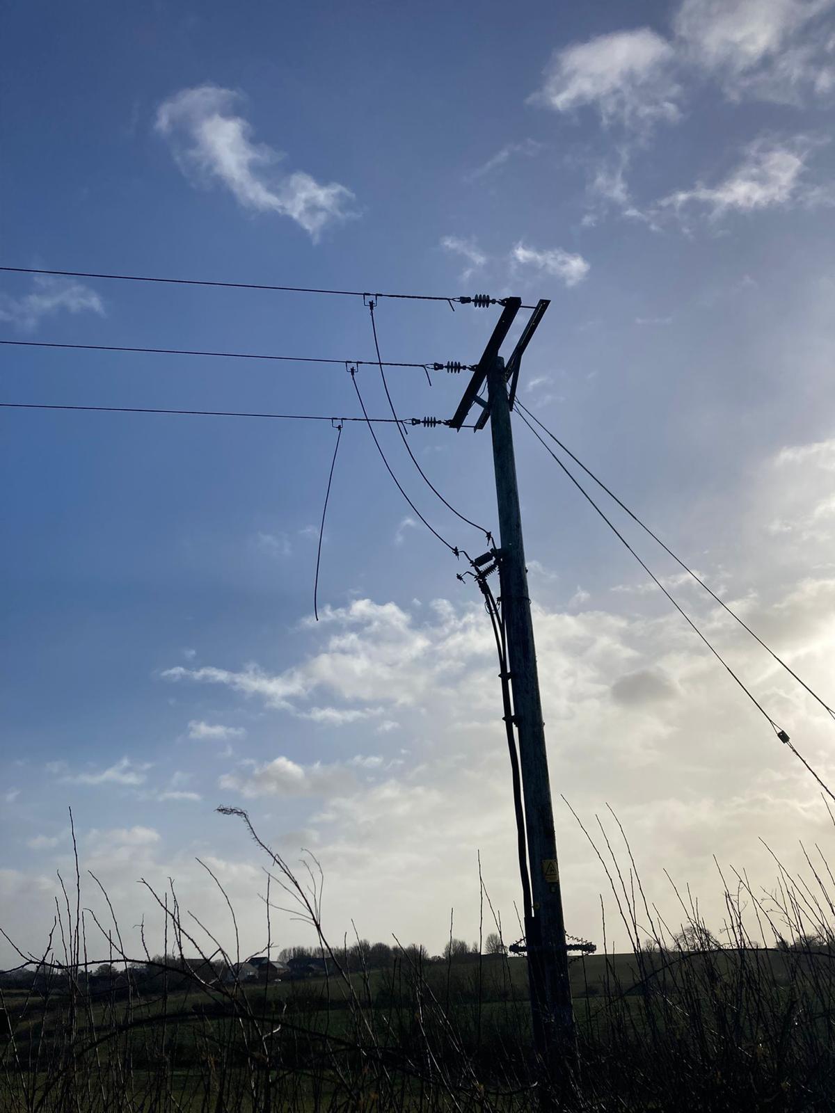Broken powerline as a result of storm damage, lines hanging down