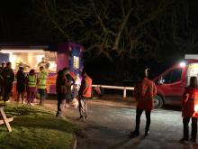 Food van with people queuing up, NPg vehicle and support staff nearby