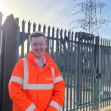 Matthew Brown in front of a substation