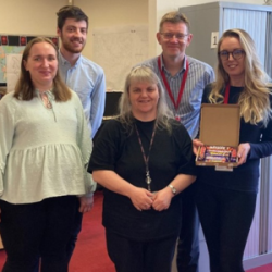 Samantha Shepherd in Streetworks winning the chocolate hamper in the LAWW poster prize draw. 